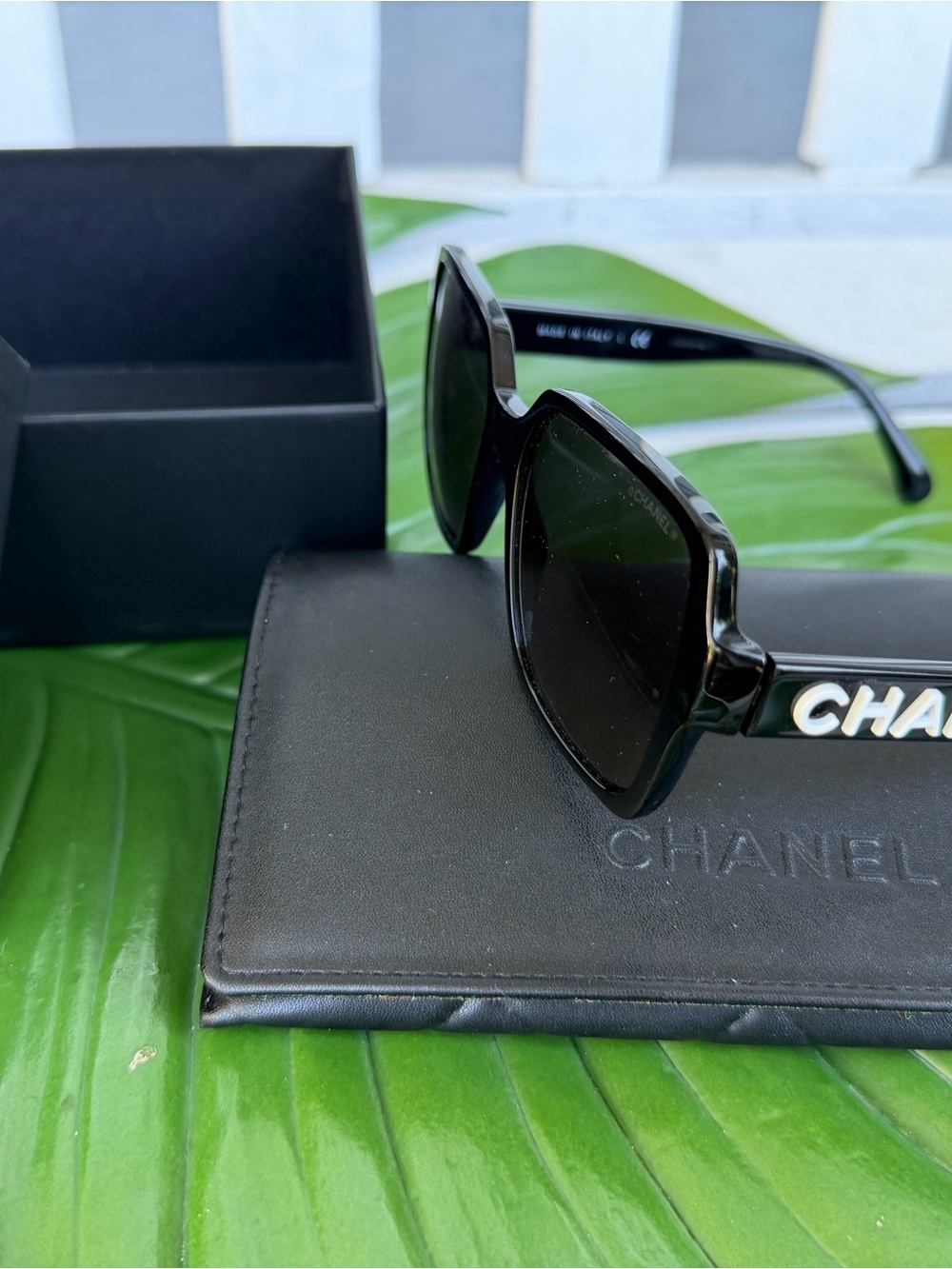 CHANEL Black Sunglasses with White Logo Temple